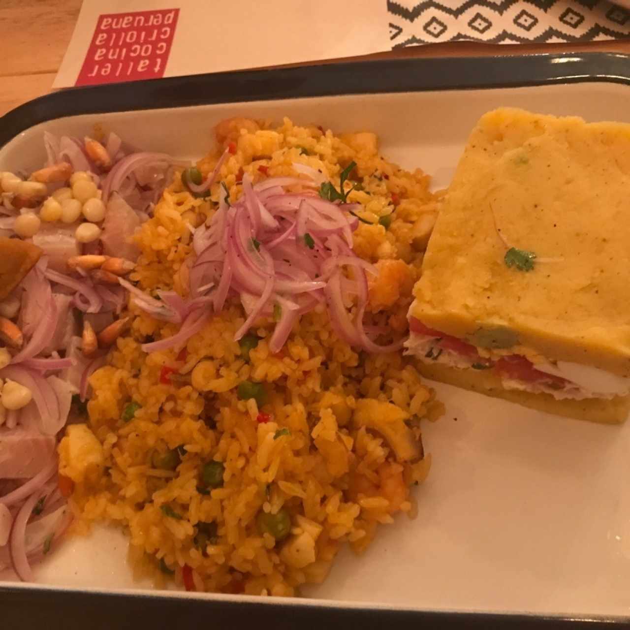 causa, cebiche y srroz con mariscos