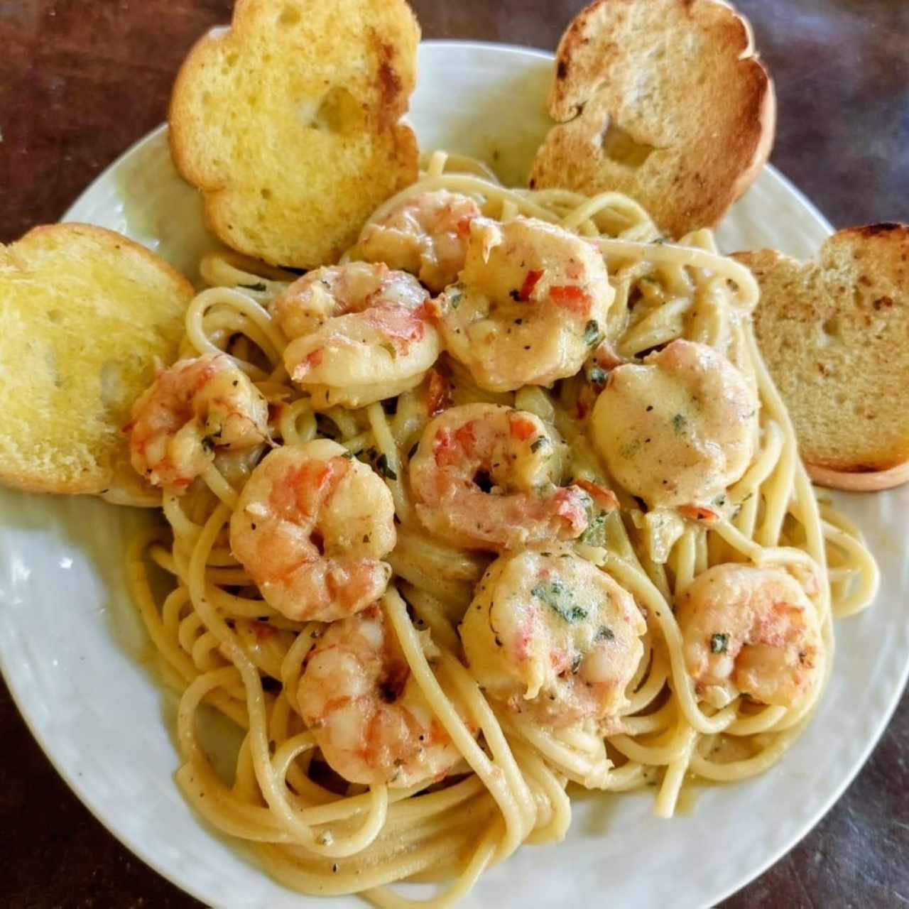 Shrimp and creamy white sauce over pasta