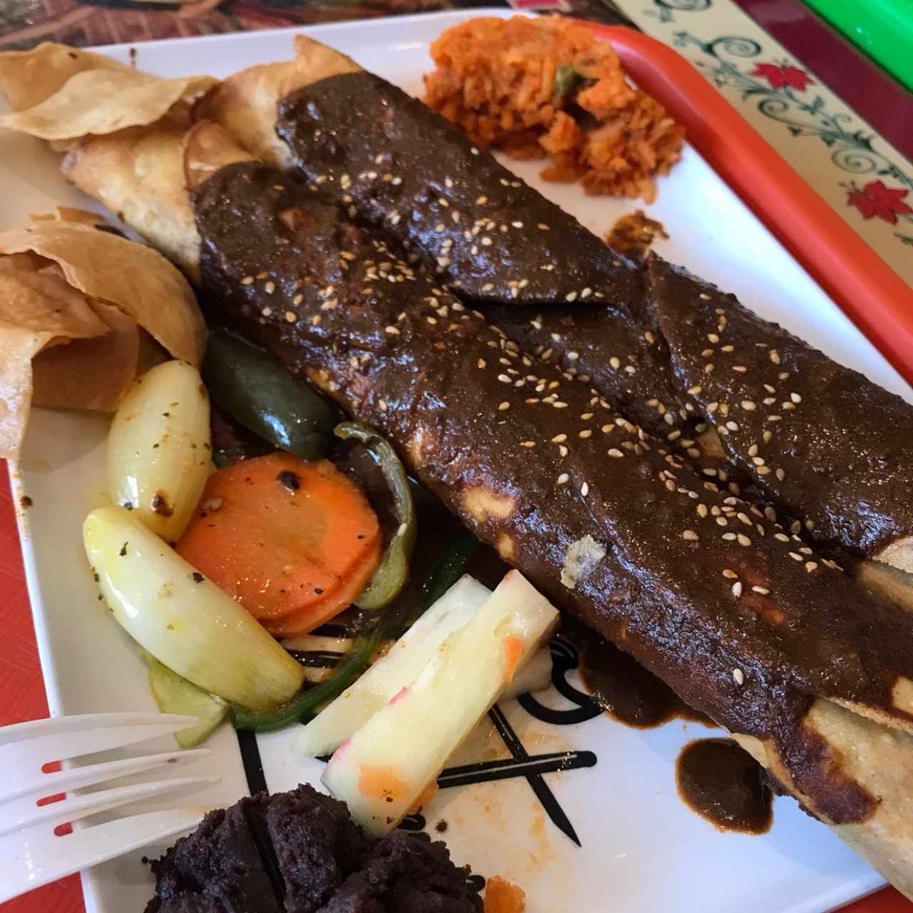 Flautas en mole poblano