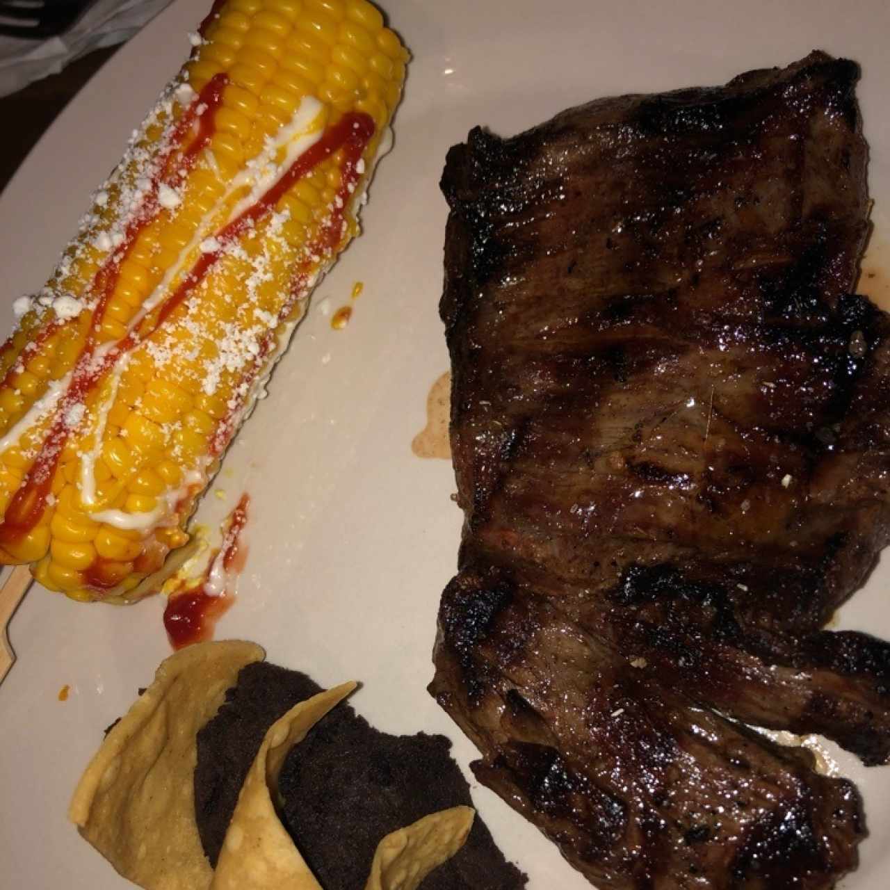 1/2 lb de entraña con guarnicion de elote loco y frijoles