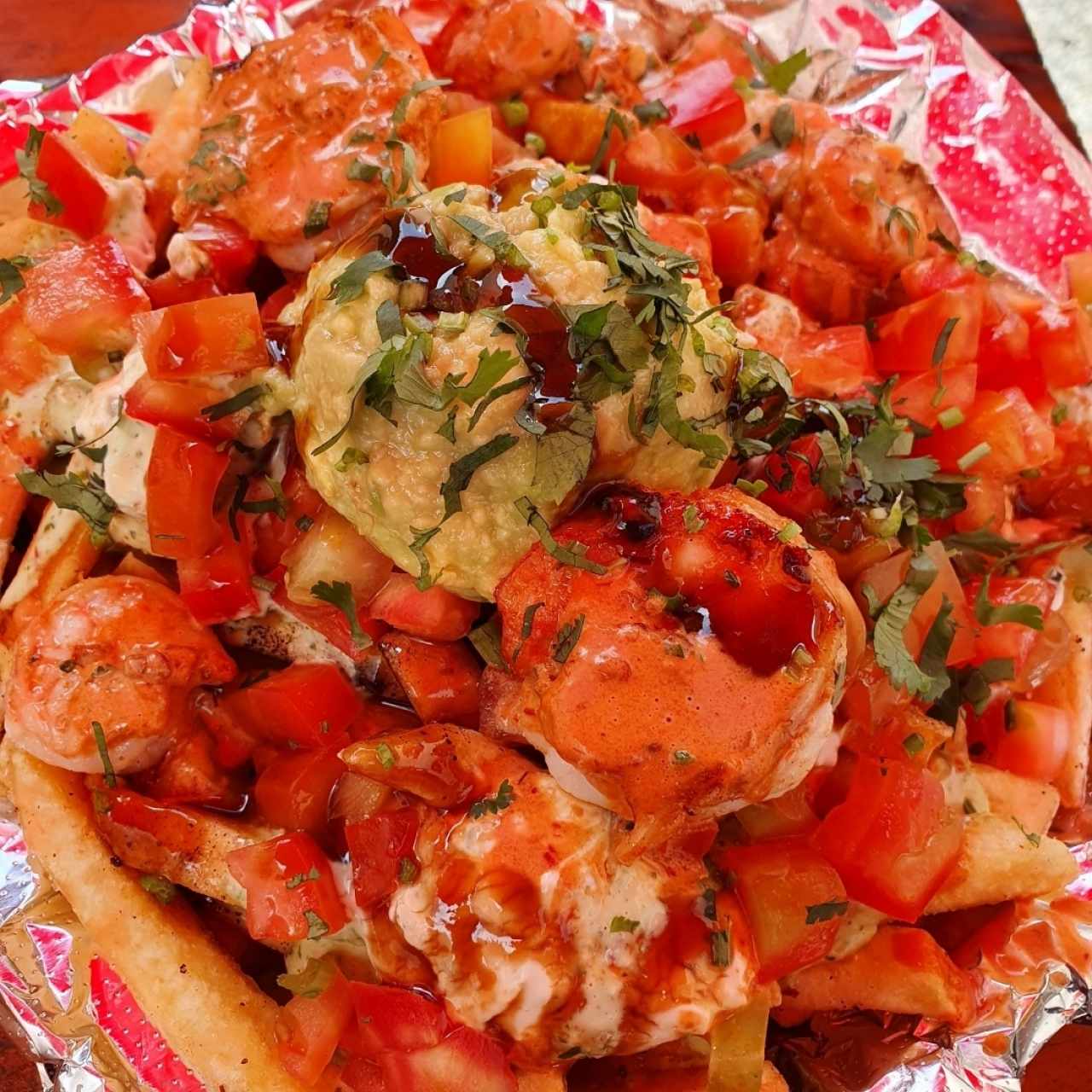 Papas con camarones al ajillo