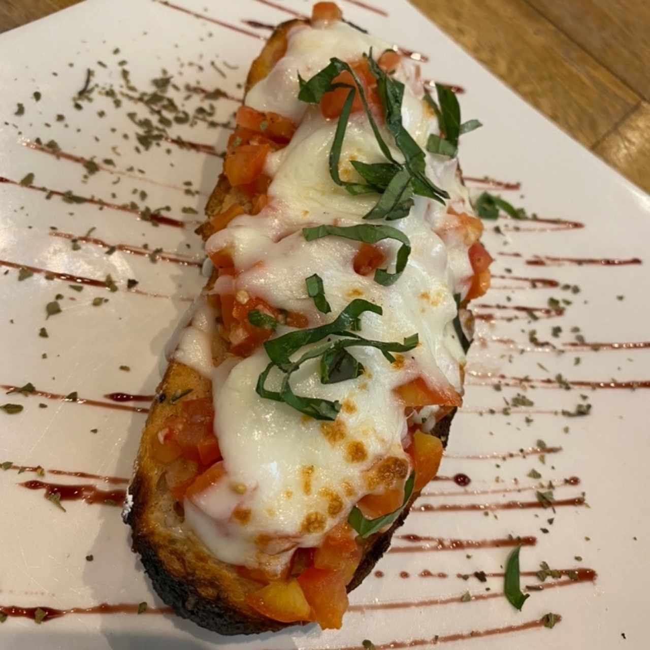 Brucheta de tomate gratinado