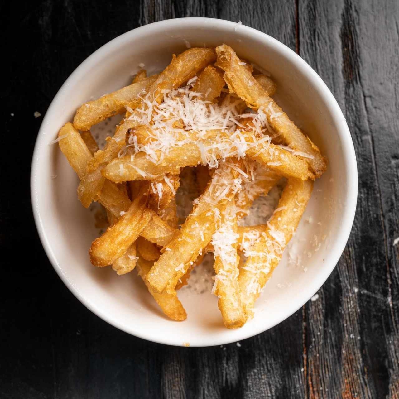 Papas Francesas con Perfume de Trufas y Granna Padano