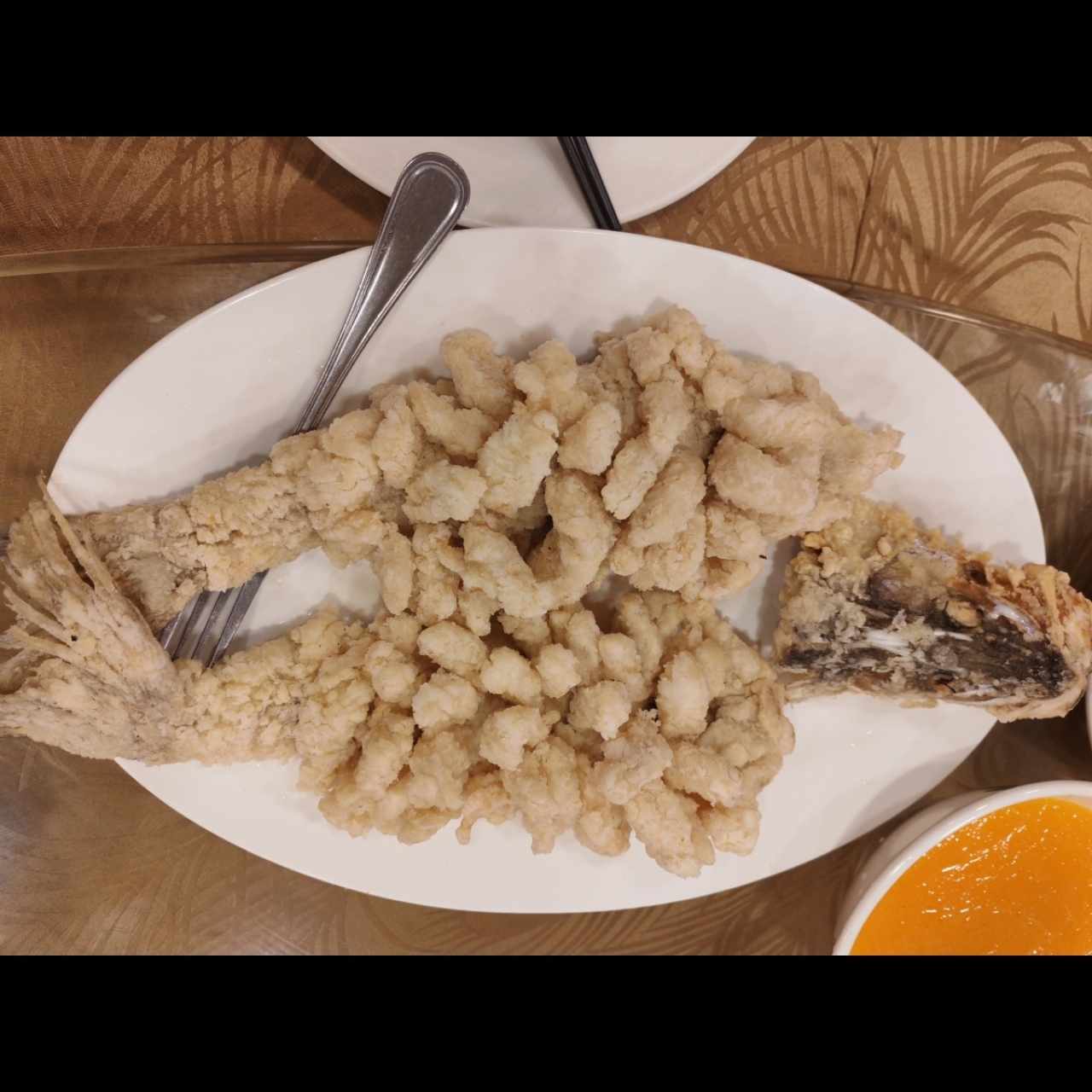 Pescado racimo de uvas con salsa de naranja 