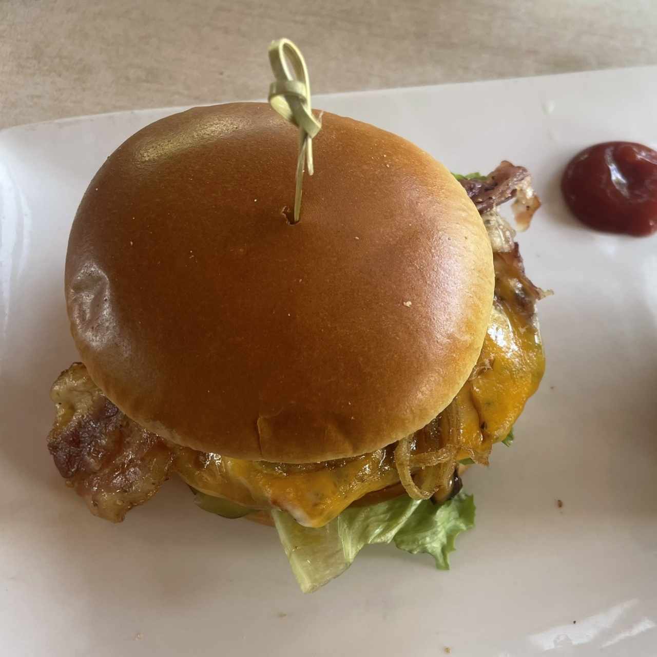 BIG AF FRIDAYS ULTIMATE SIGNATURE WHISKEY-GLAZED BURGER