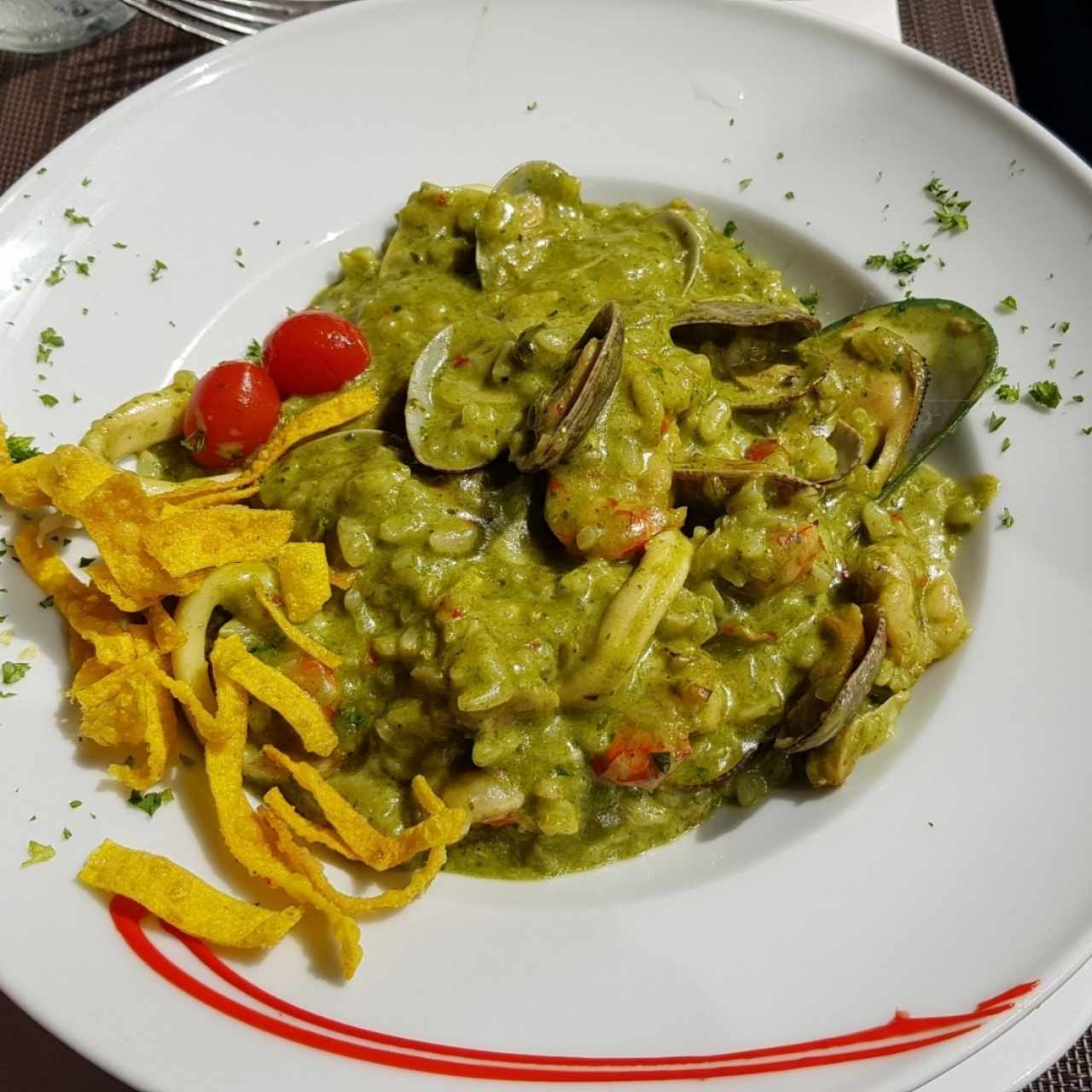 Risotto frutti di mare en salsa verde