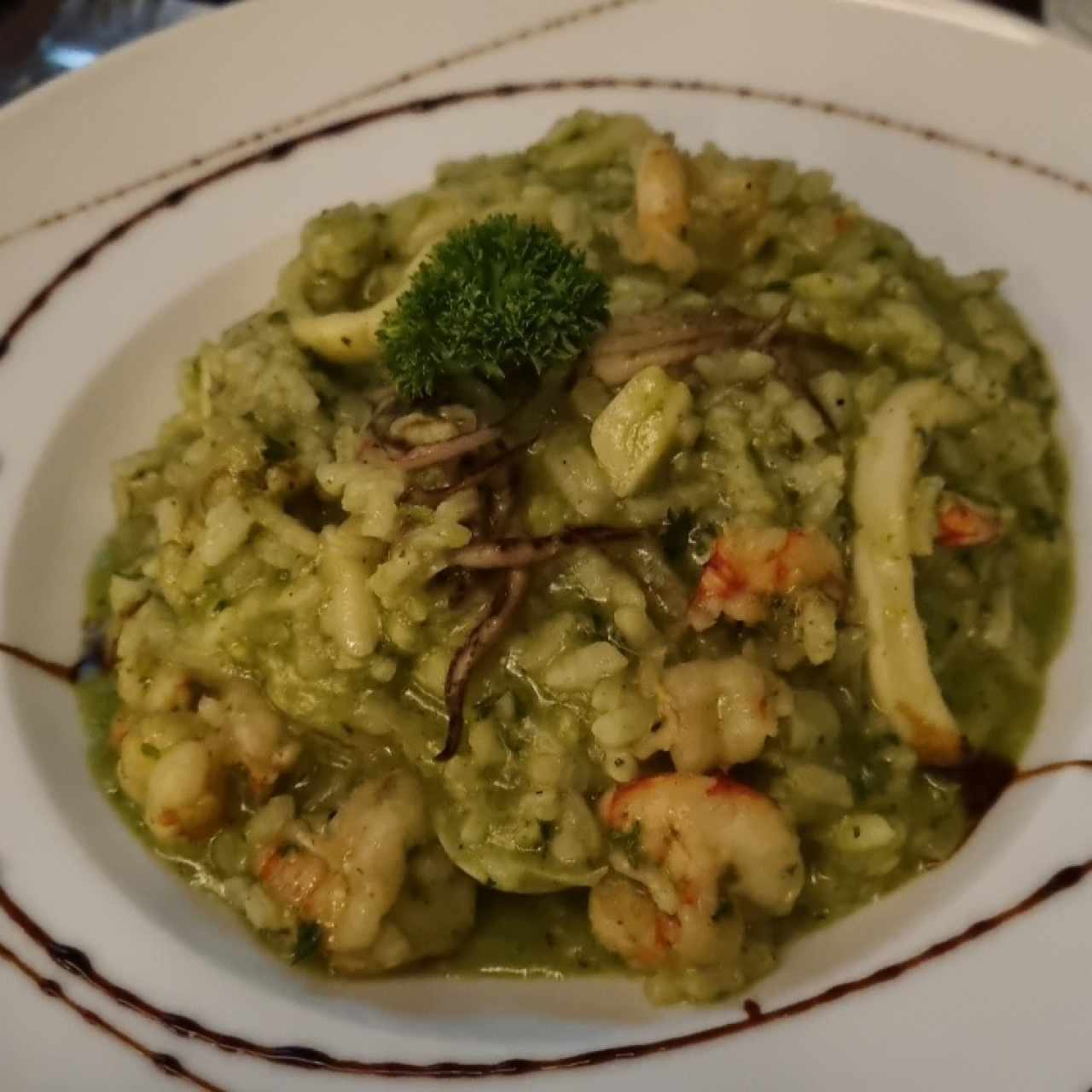Risotto frutti di mare en salsa verde