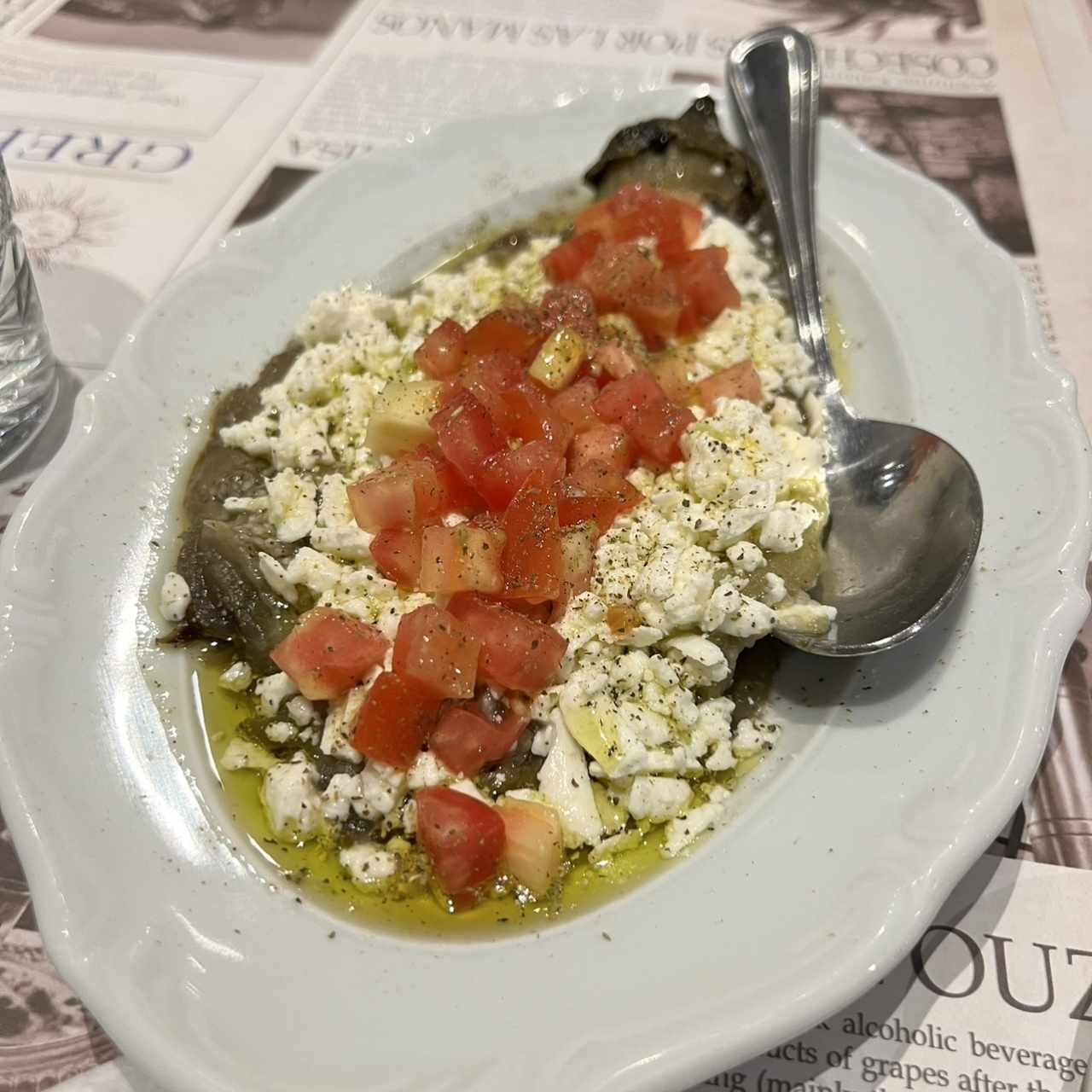 Berenjena con queso y tomates