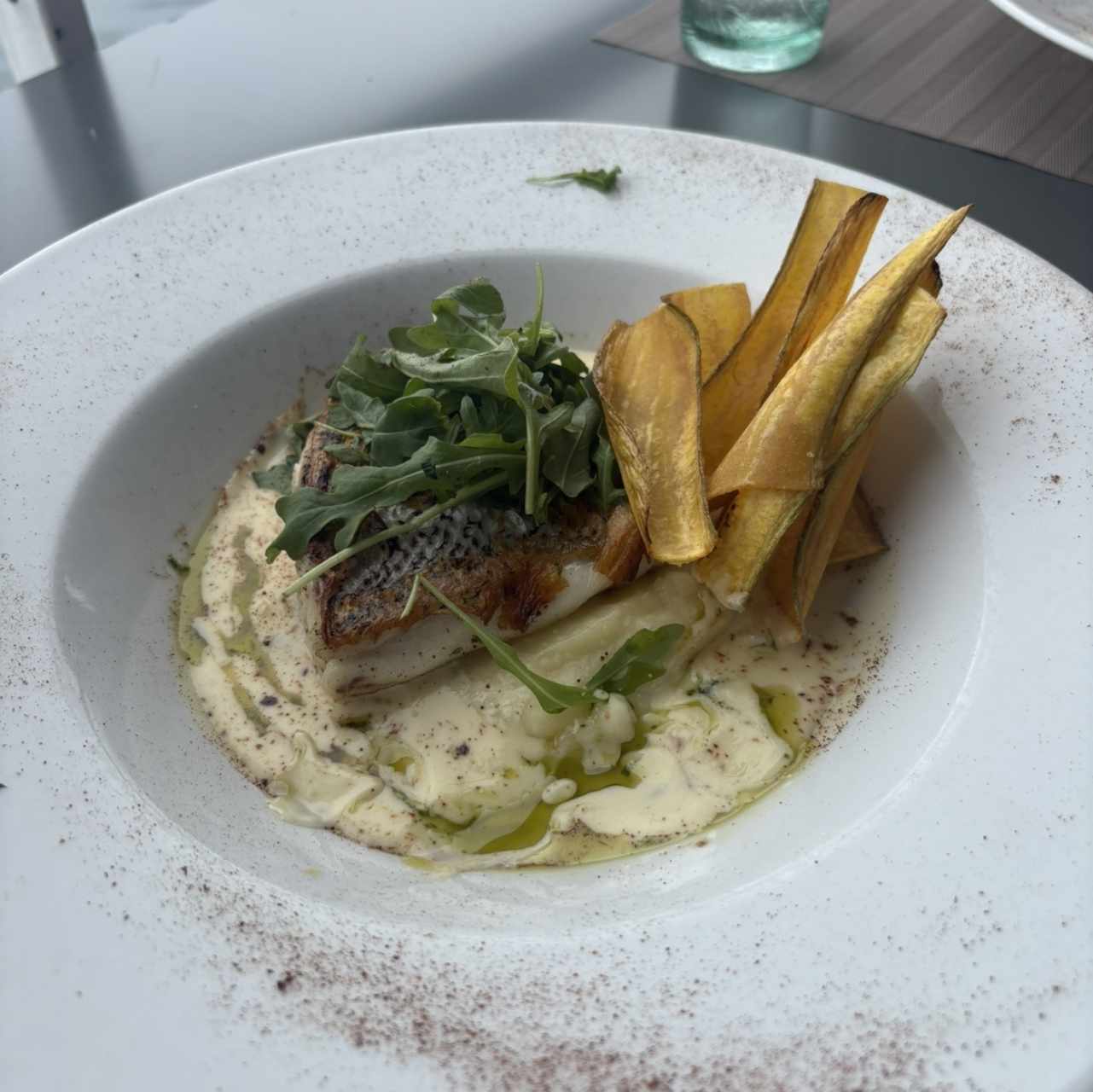 Filete de pescado en salsa de coco y mango