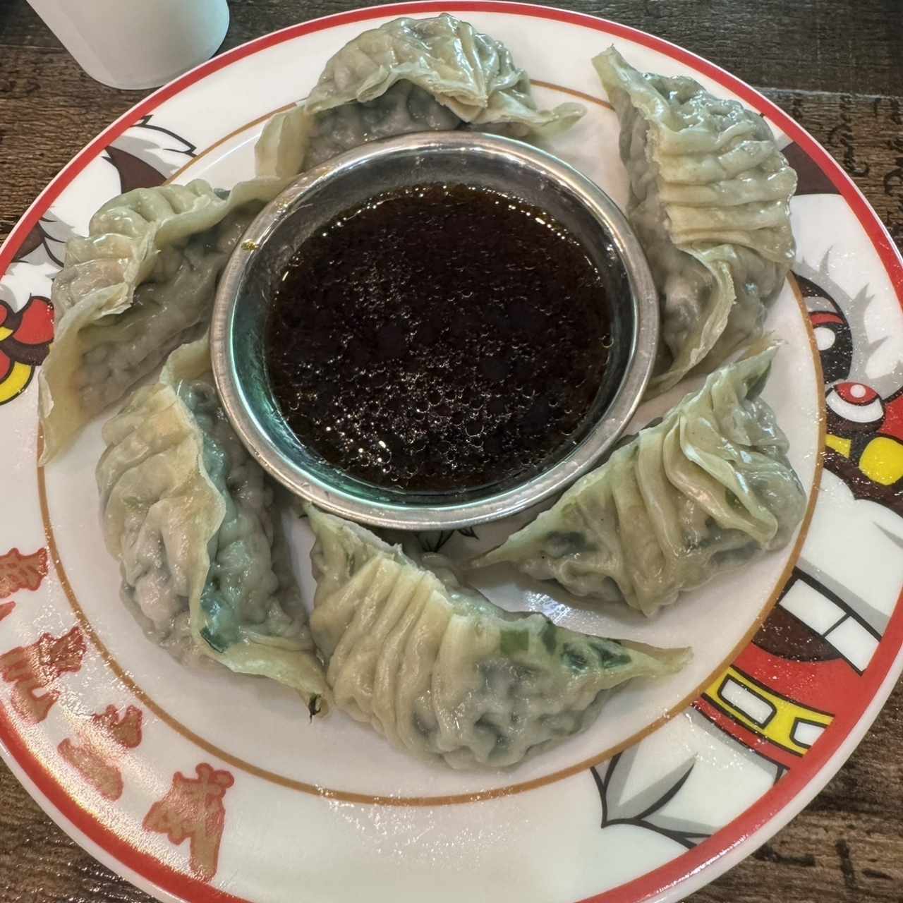 Wotip al vapor de cebollina y puerco