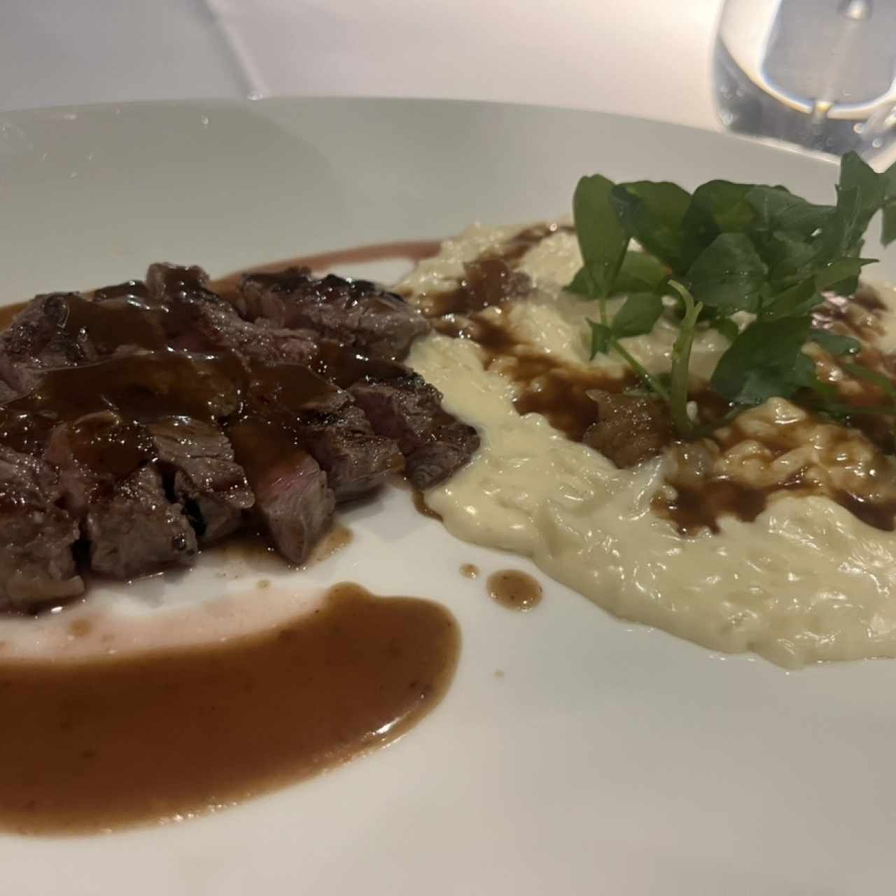 Arroz meloso de queso de cabra con rib eye
