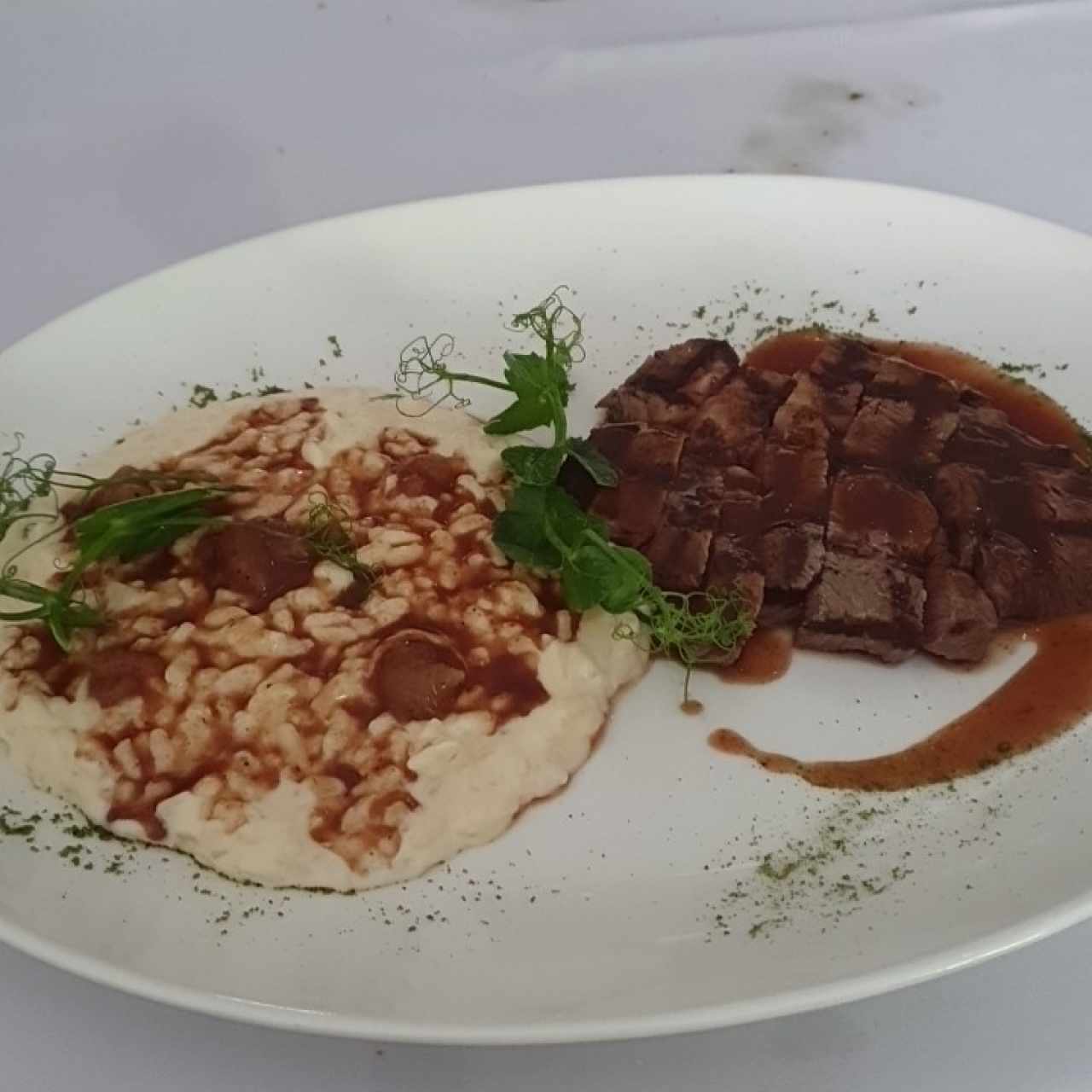 Arroz meloso de queso de cabra con rib eye