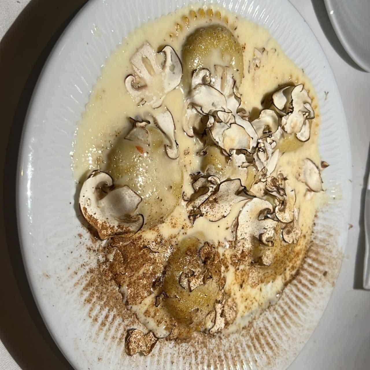 Raviolli Tondi de Hongos y Escargots