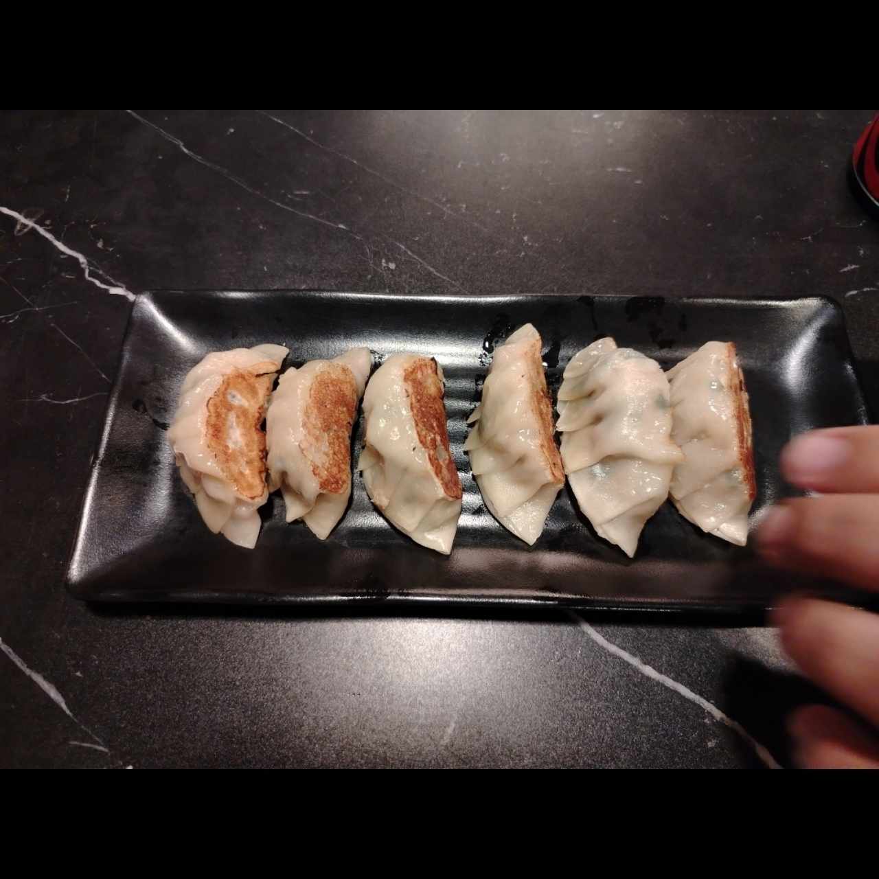 Gyosas de puerco a la plancha. 