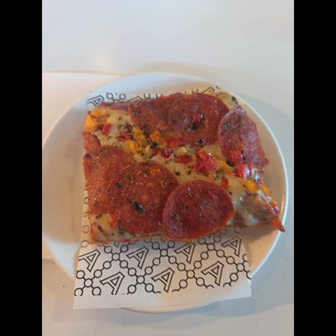 Slice de pizza de pepperonni