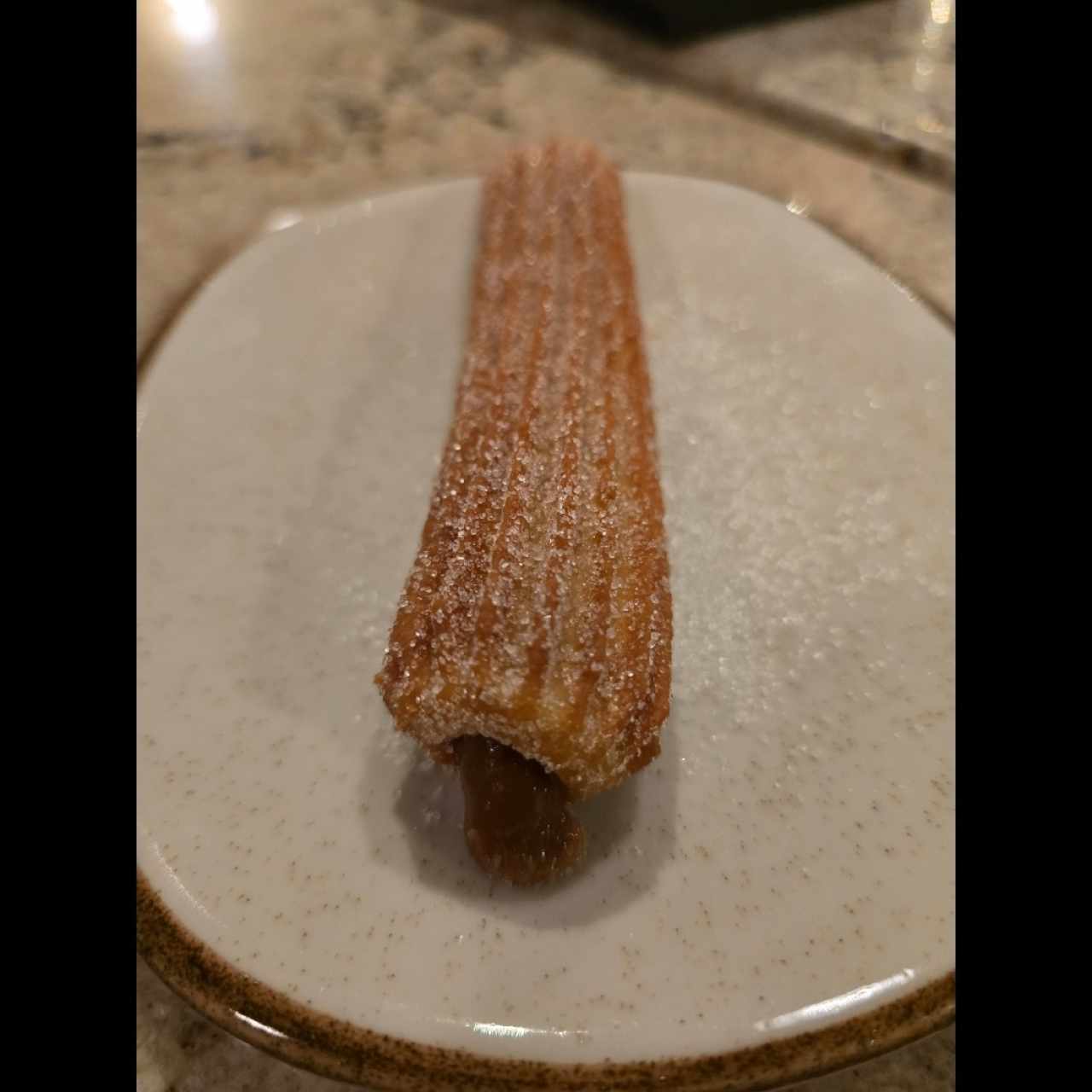 Churro relleno de manjar