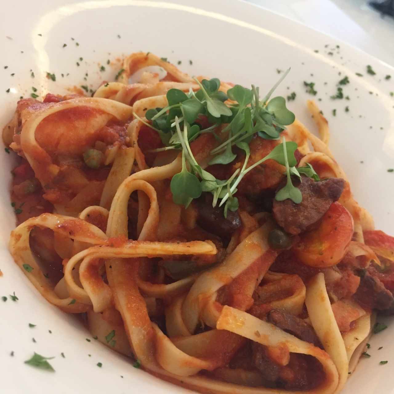 Lagostine con tomato y curry