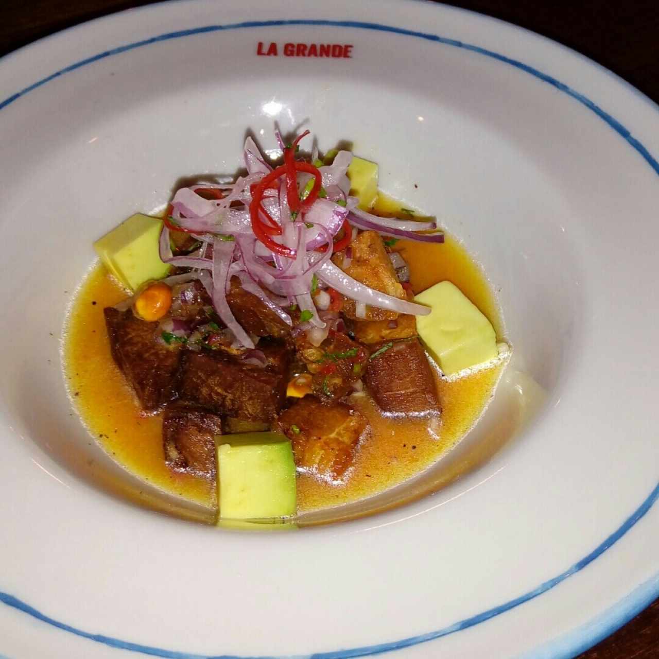 chancho acevichado con leche de tigre y jugó de rocoto