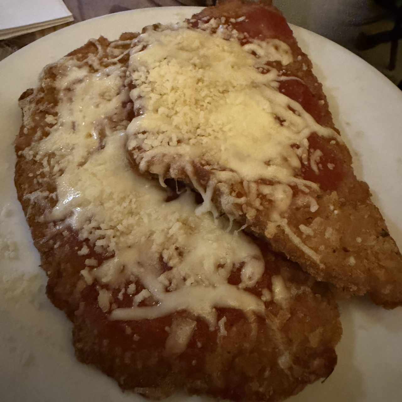 Milanesa de pollo a la parmiggiana