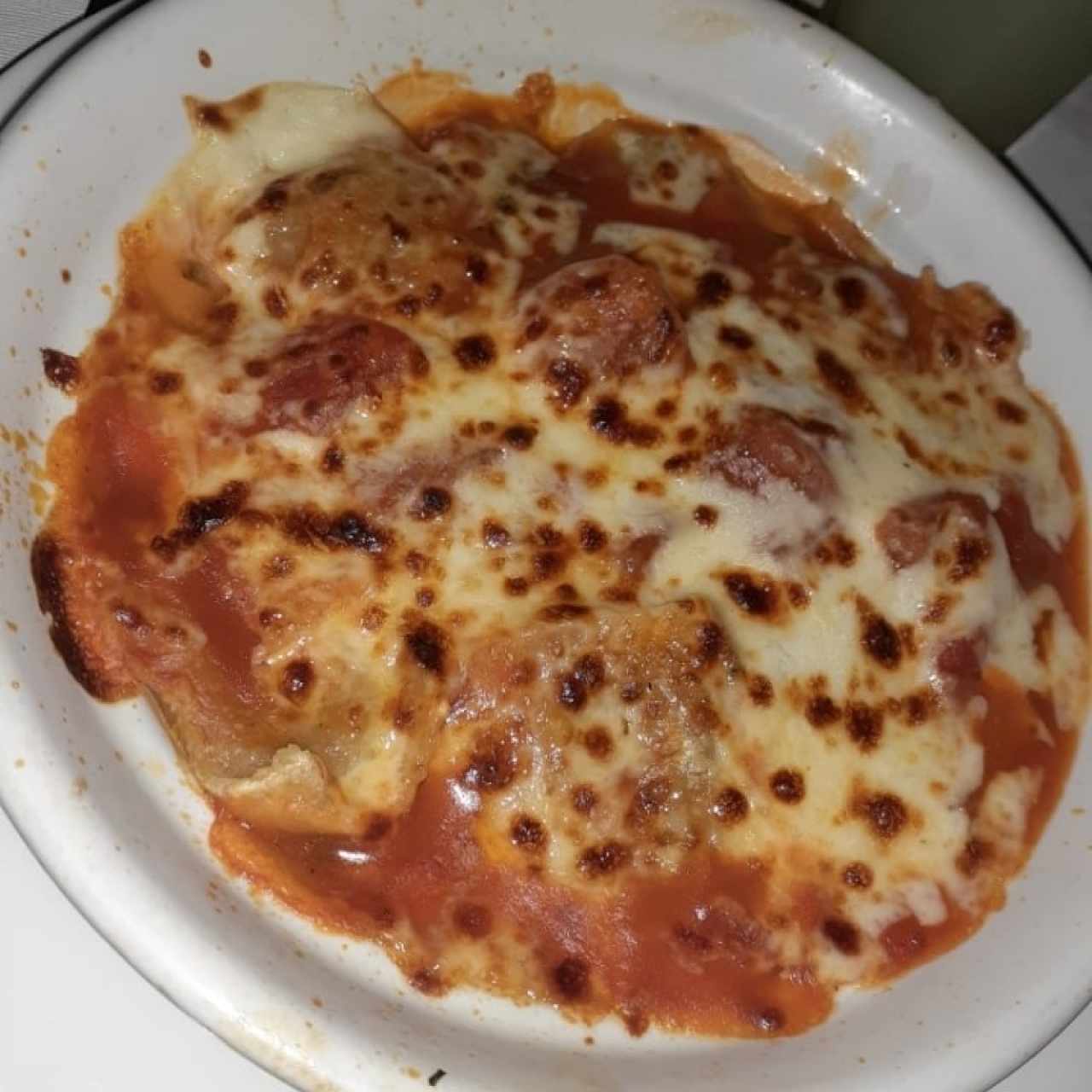 raviolis de carne gratinados