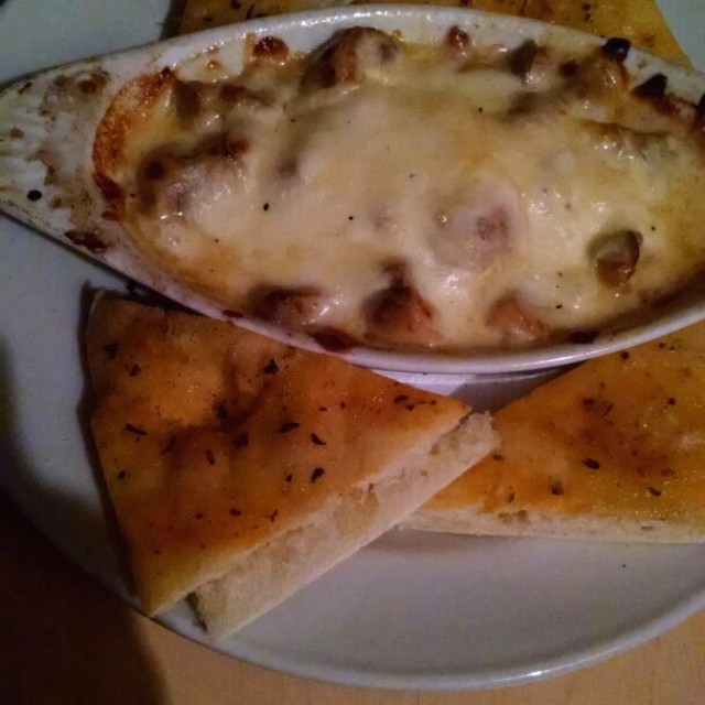 Champiñones al ajillo gratinados