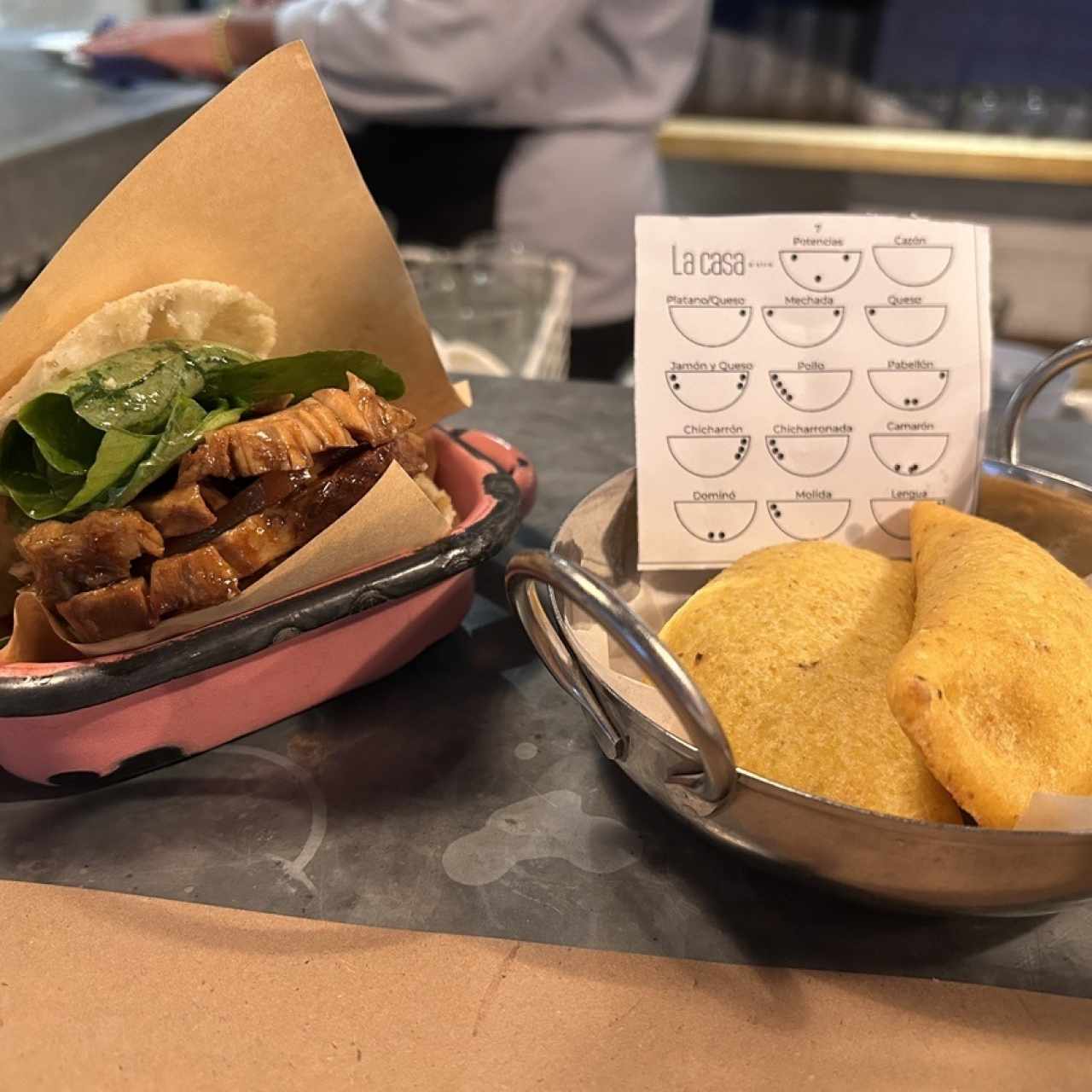 Arepa de cochino asado  y empanadas de cazon y carne desmechada 