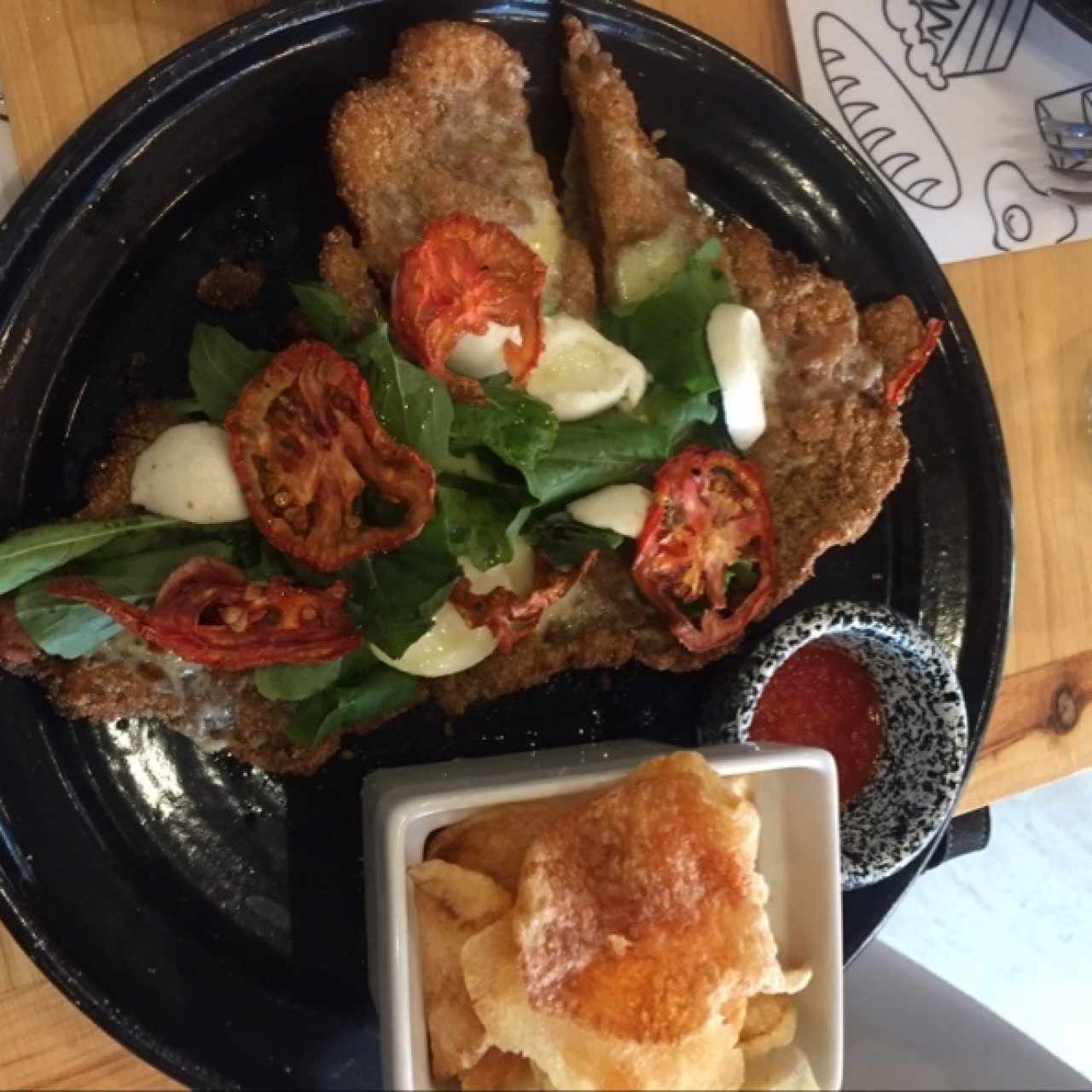 milanesa tomates confitados Bococcini rugula