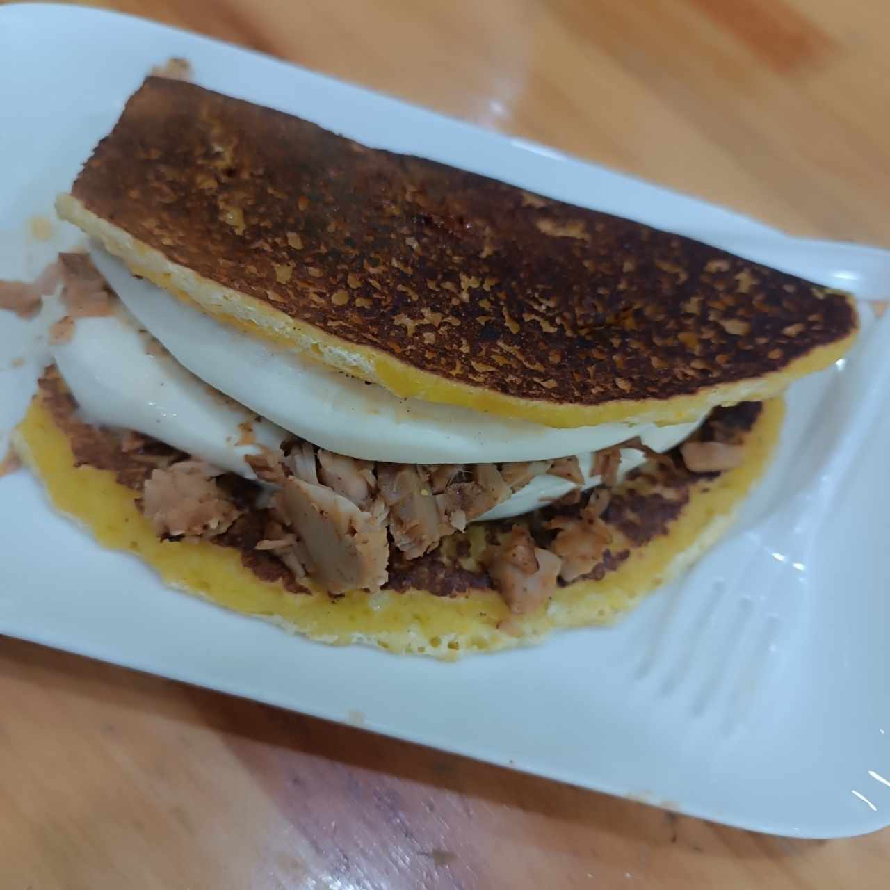 cachapa con quedó de mano y pernil
