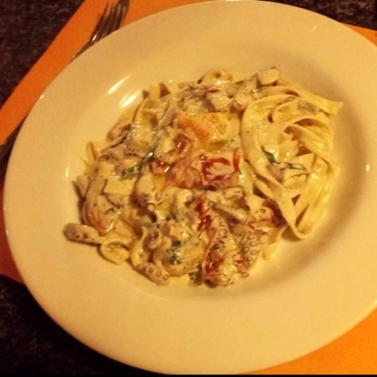 Fettuccini con Pulpo y tomastes secos 
