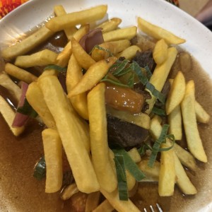 Lomito Salteado - Sauteed Steak with French fries and rice