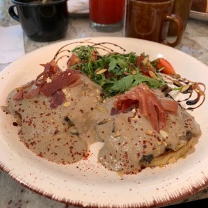 huevos pochados con salsa de hongos