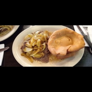 Bistec encebollado 