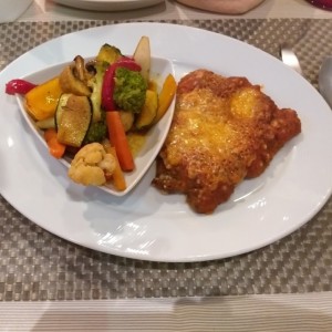 Res gratinada con vegetales salteados 