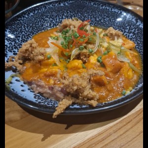 Guacho con guandú, coco y mariscos
