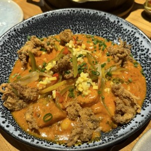 Guacho con guandú, coco y mariscos