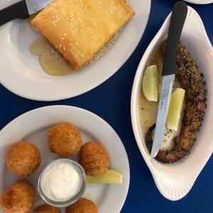 pulpo , feta al filo miel y ajonjoli , croquetas de queso