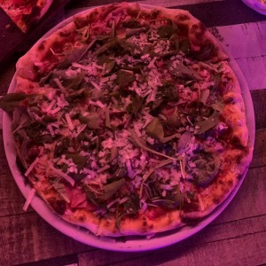 Pizza con rucula y jamon