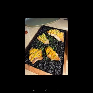 arroz tinta de calamar con Mero