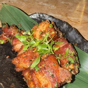 Taquitos de pork belly