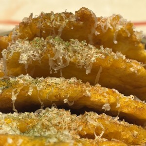 Patacones con parmesano y trufa