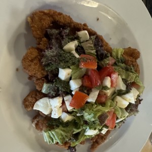 Milanesa con tomate cherry