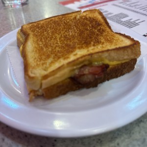 Derretido bacon con queso