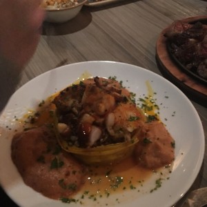 Langosta sobre falso risotto de Cebada y papada de cerdo